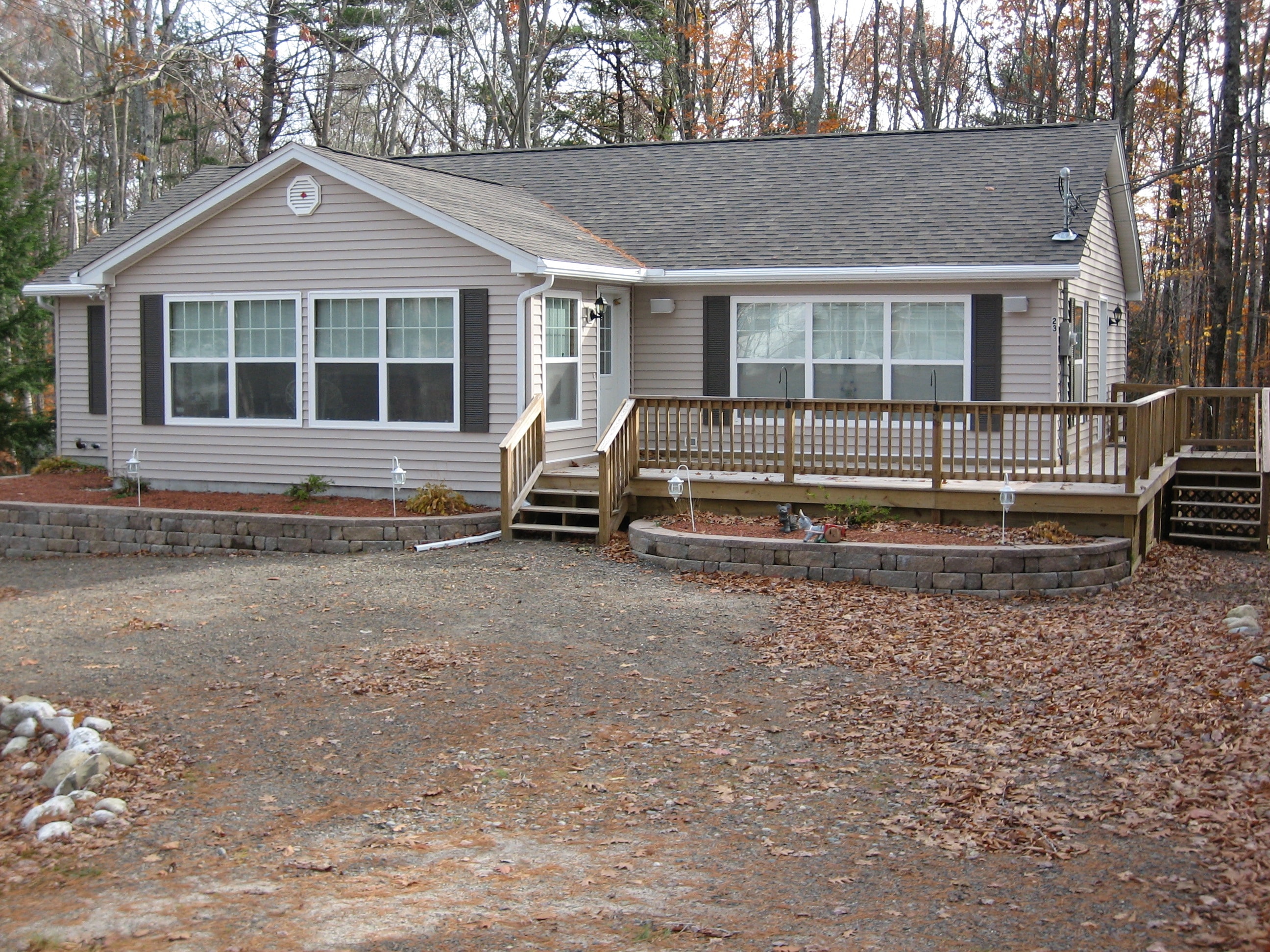 Holland Ranch with stone retaining walls and deck