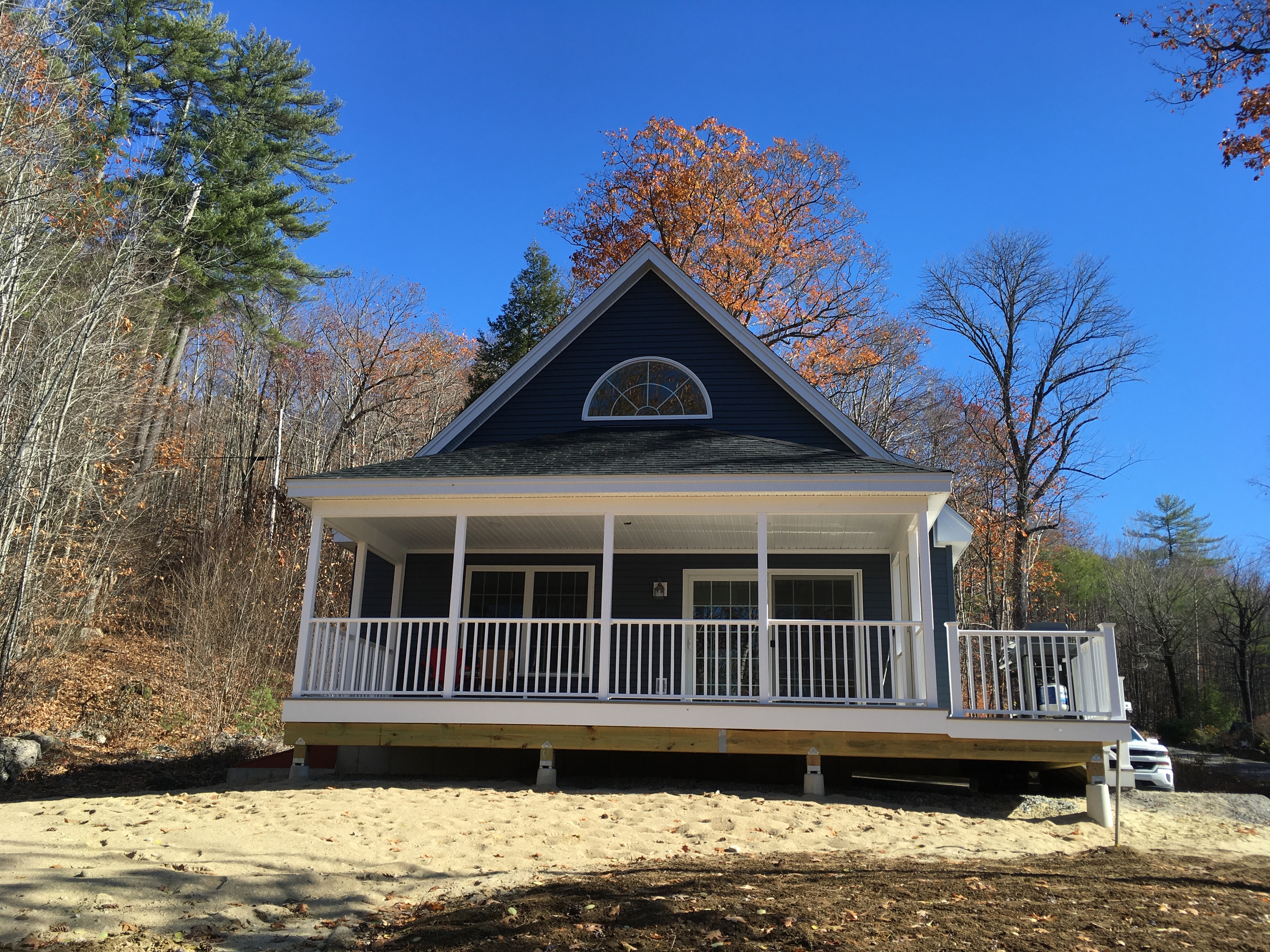 Cape style home with covered porch
